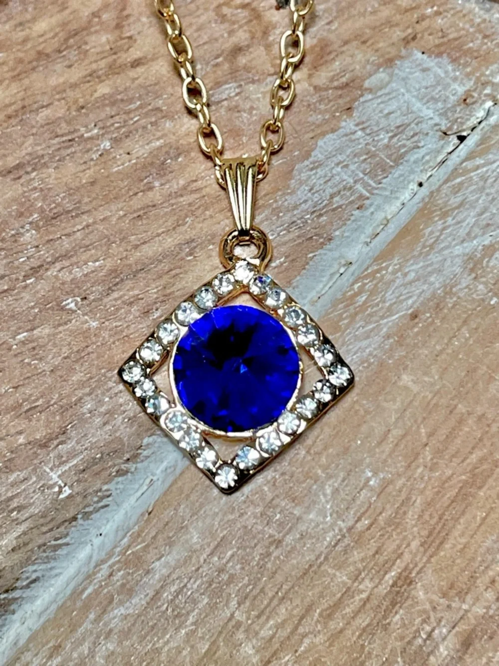 Gold-Tone Necklace with Royal Blue Round Crystal Pendant